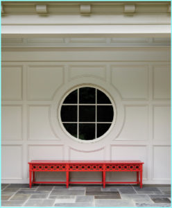Oculus window, red bench, slate tile foor